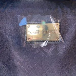 Red,white, and black Tommy Hilfiger duffle bag